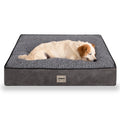 Dog sleeping on a gray orthopedic pet bed with textured surface