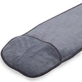 Gray microfiber bath mat with soft texture and rounded edges on white background