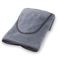 Folded gray microfiber towel with dark trim on a white background