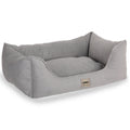 Gray textured rectangular pet bed with raised sides and Junco Pets label on the front