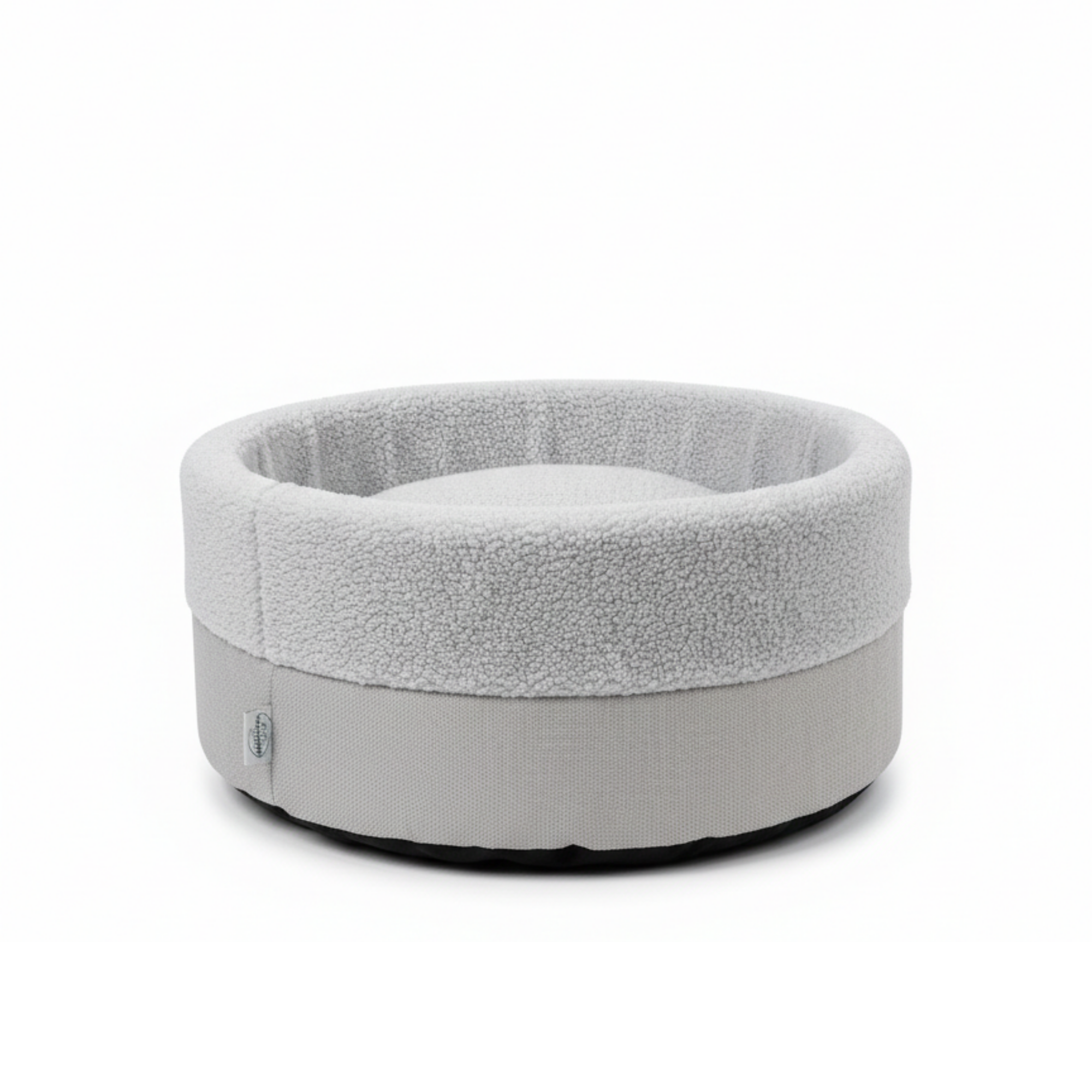Round light gray plush pet bed with raised sides and fleece interior on white background