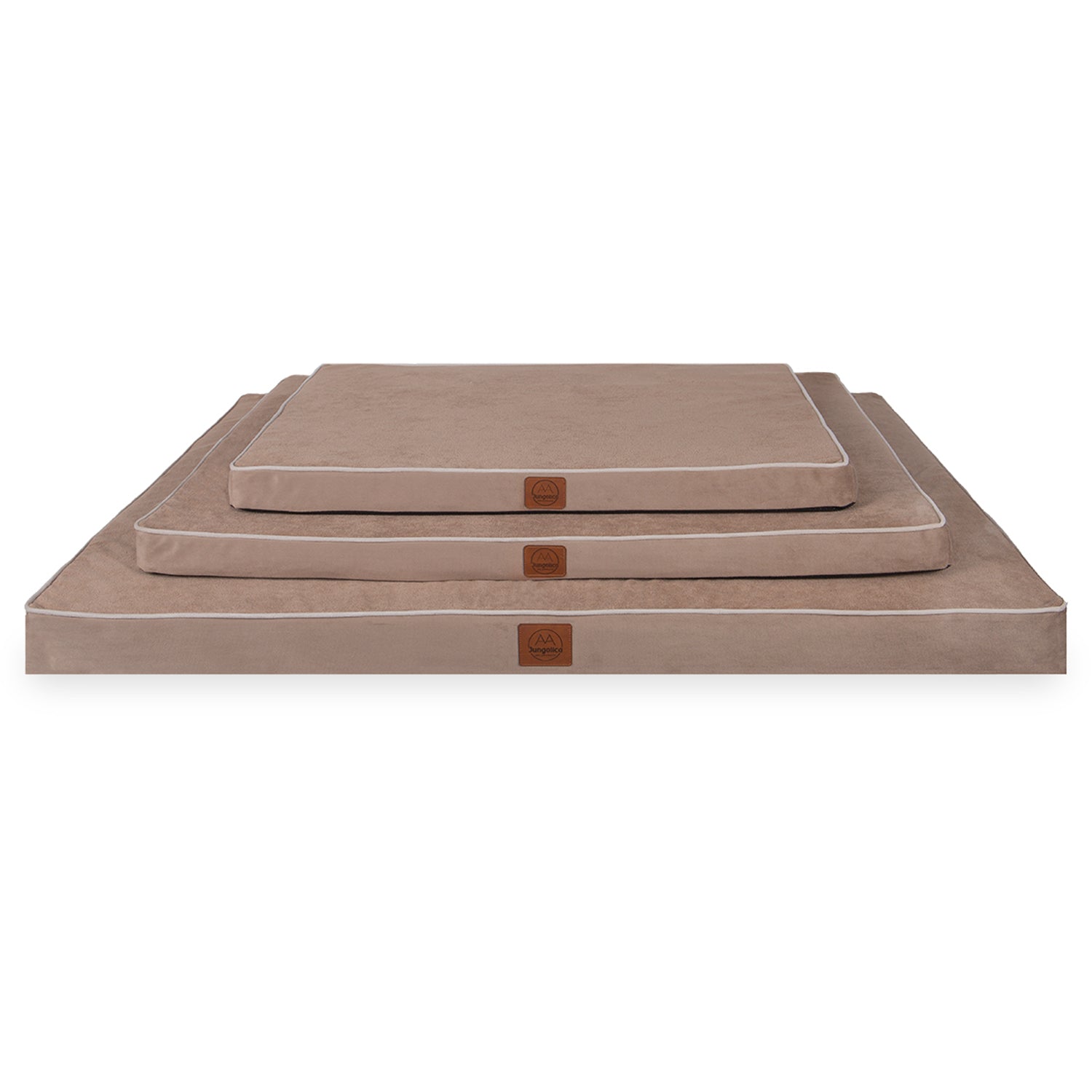 Stacked beige rectangular cushions in three sizes with white piping edges on white background