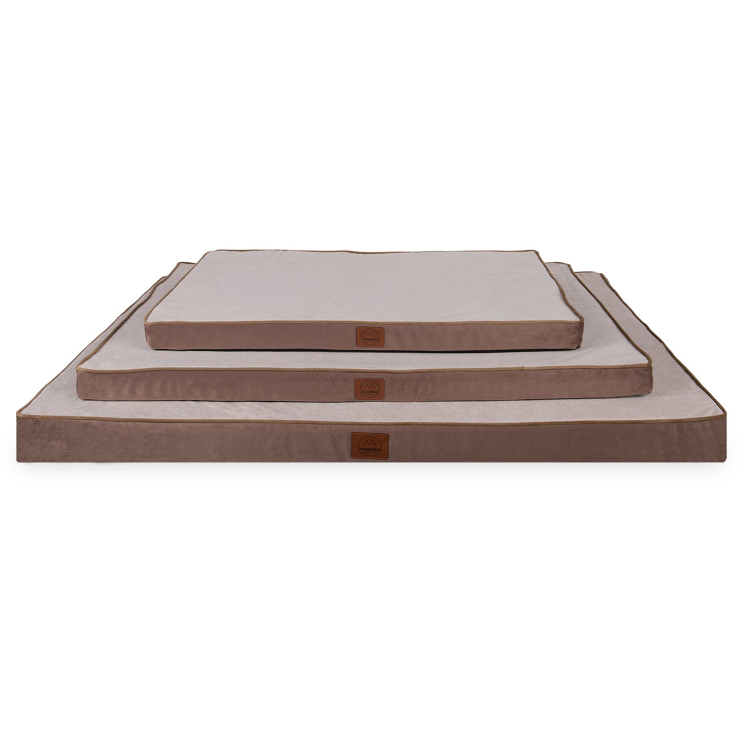 Stacked rectangular beige and brown cushions in three sizes on white background