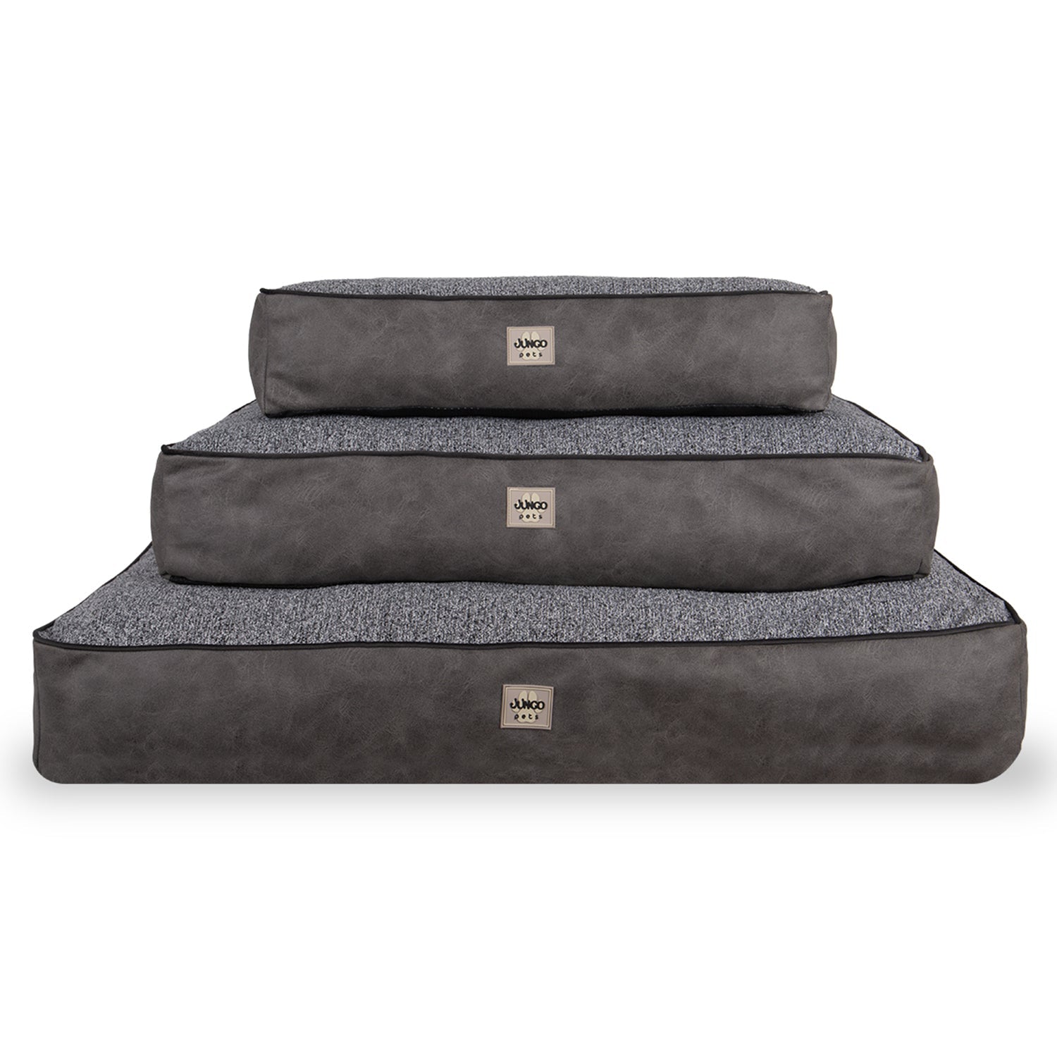 Stacked gray rectangular pet beds in three sizes with textured fabric and leather sides