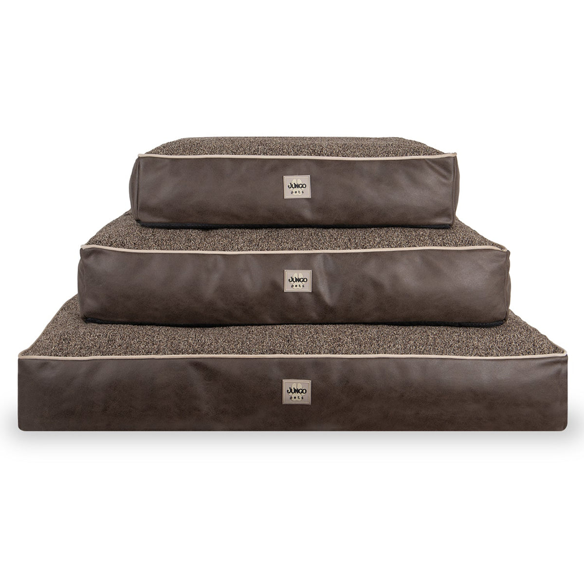 Stacked brown rectangular pet beds in three sizes with soft fabric tops