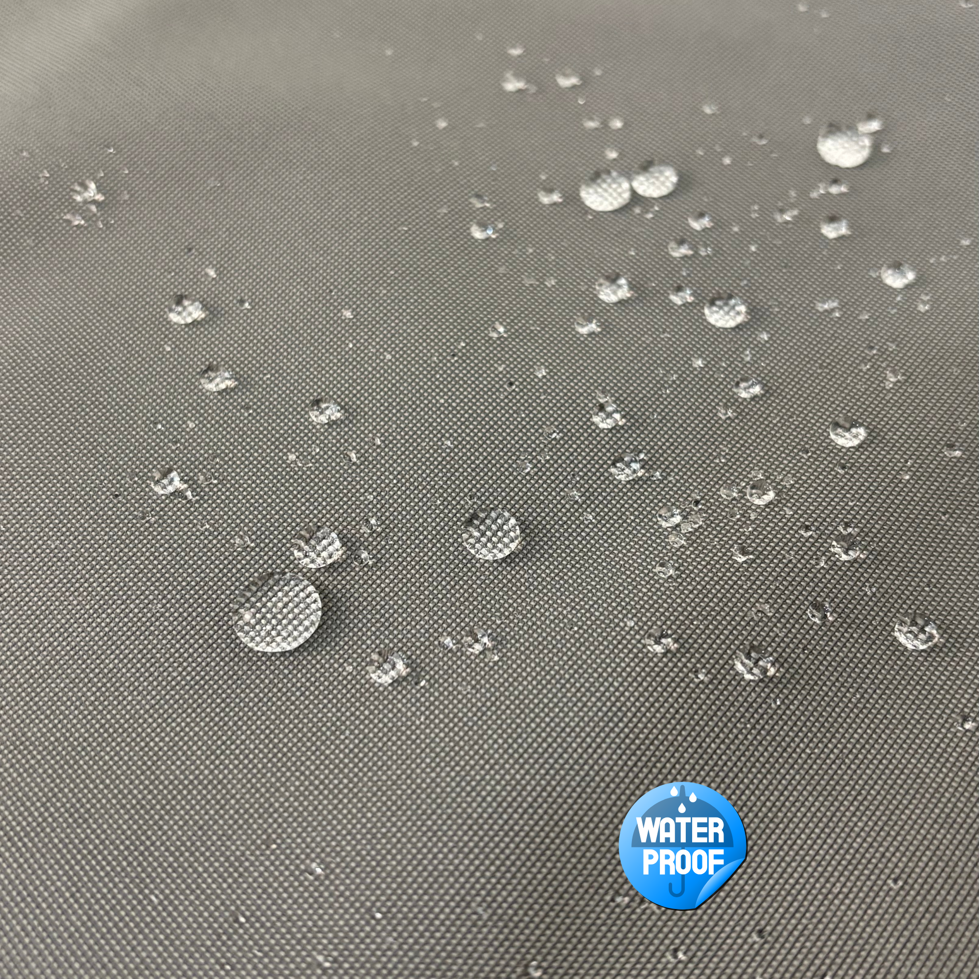 Waterproof textile fabric with water droplets on grey surface