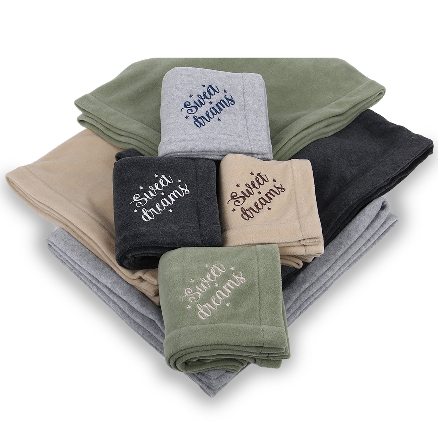 Stack of folded fleece blankets in assorted colors with 'Sweet dreams' embroidered