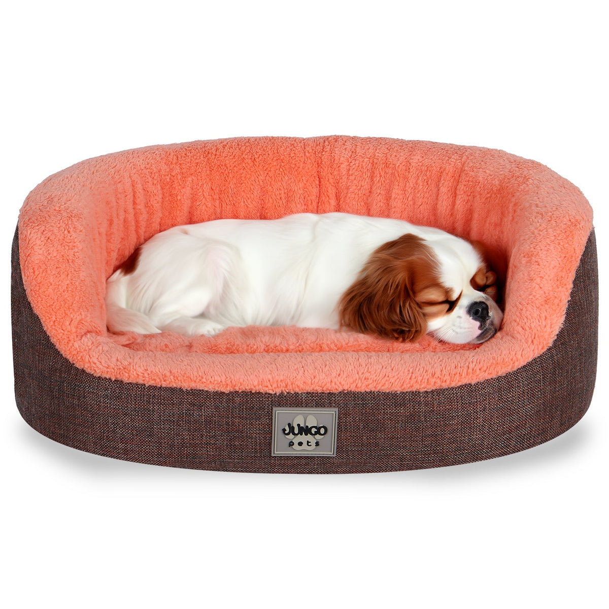 Small dog sleeping in a peach-colored plush dog bed with brown exterior