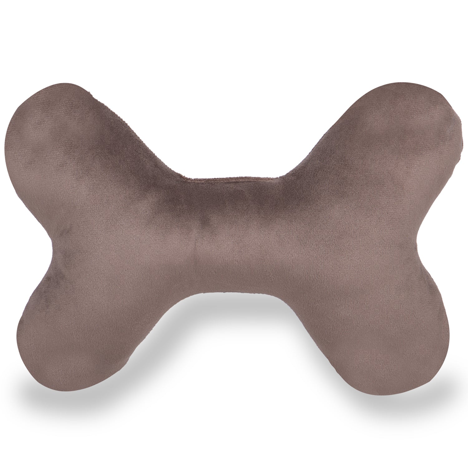 Bone shaped beige plush pillow on white background, soft home textile accessory