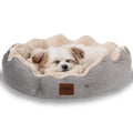 Small dog sleeping on a gray-beige ultra soft, reversible, non-slip pet bed