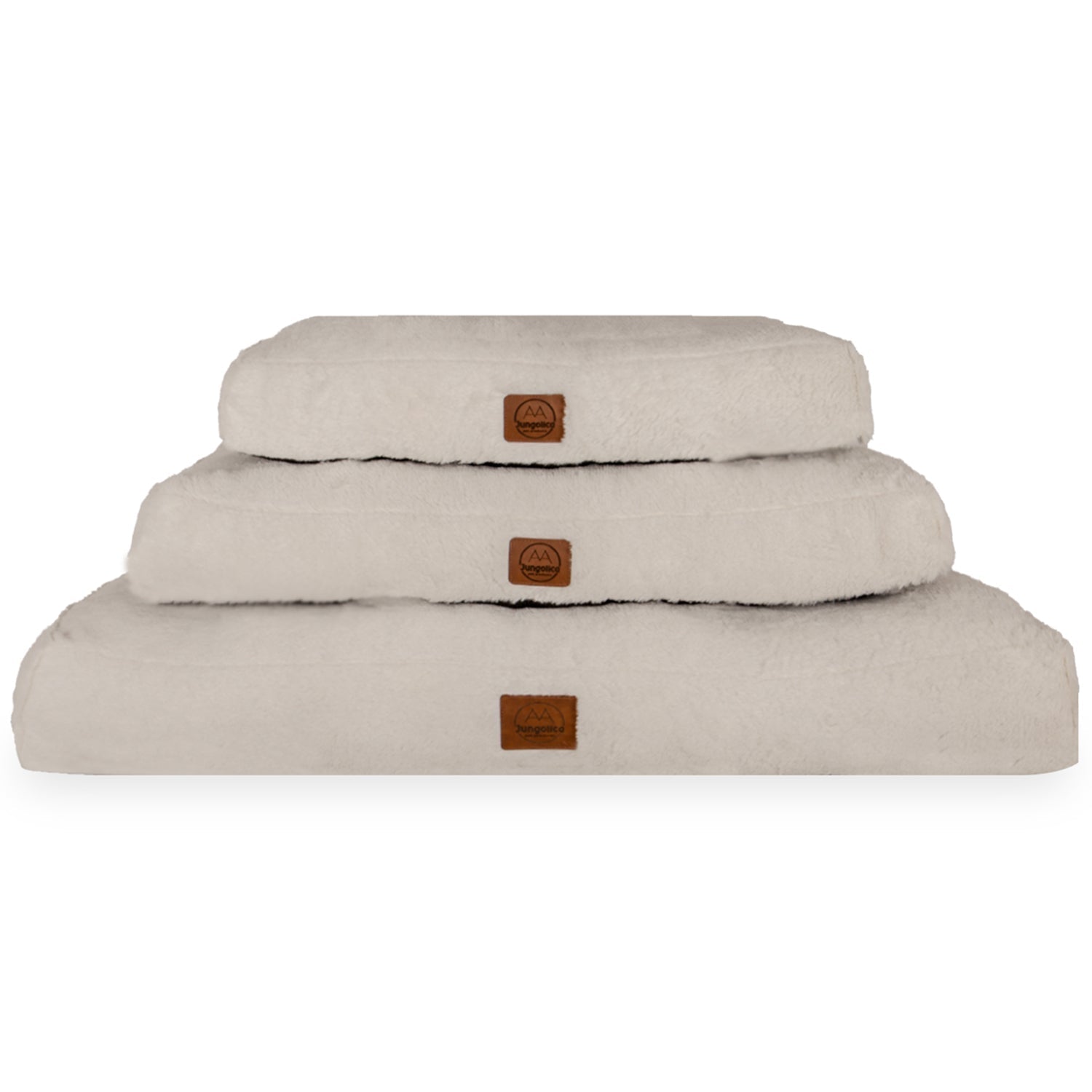 Stack of three cream-colored, ultra-soft pet beds for cats and dogs with non-slip bases.