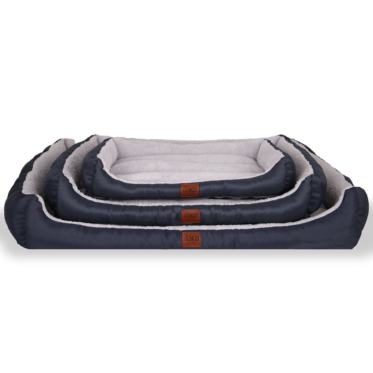 Stacked rectangular dark gray pet beds with soft, plush interiors in three sizes