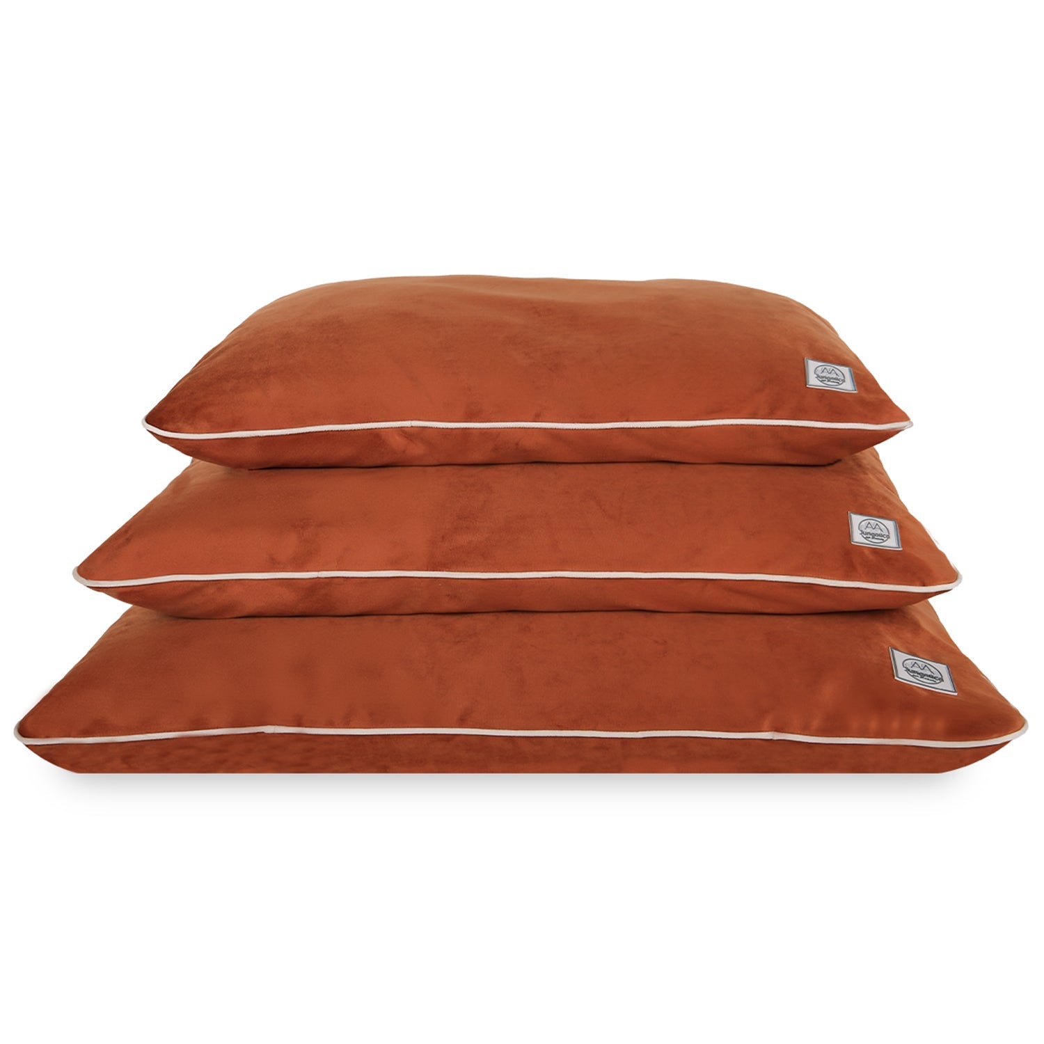 Stack of three rust-colored pet beds with removable, durable covers for cats and dogs