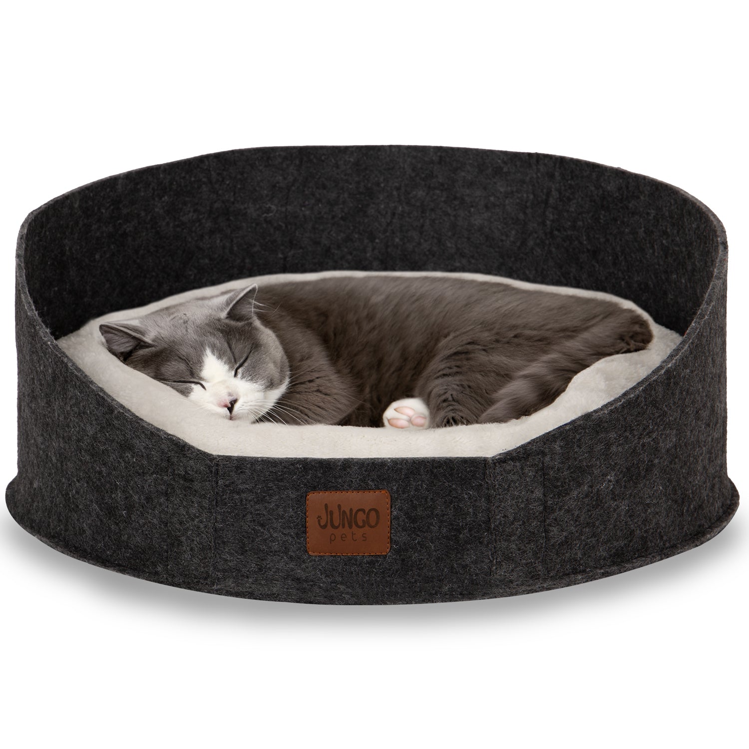 Gray and white cat sleeping in a round dark felt pet bed with soft cushion