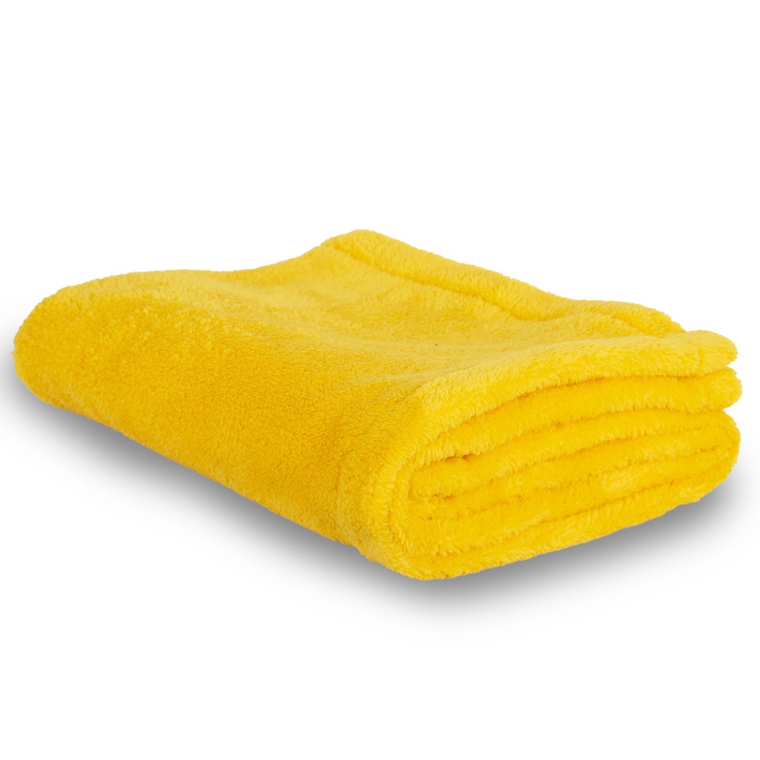 Folded soft yellow microfiber towel on white background