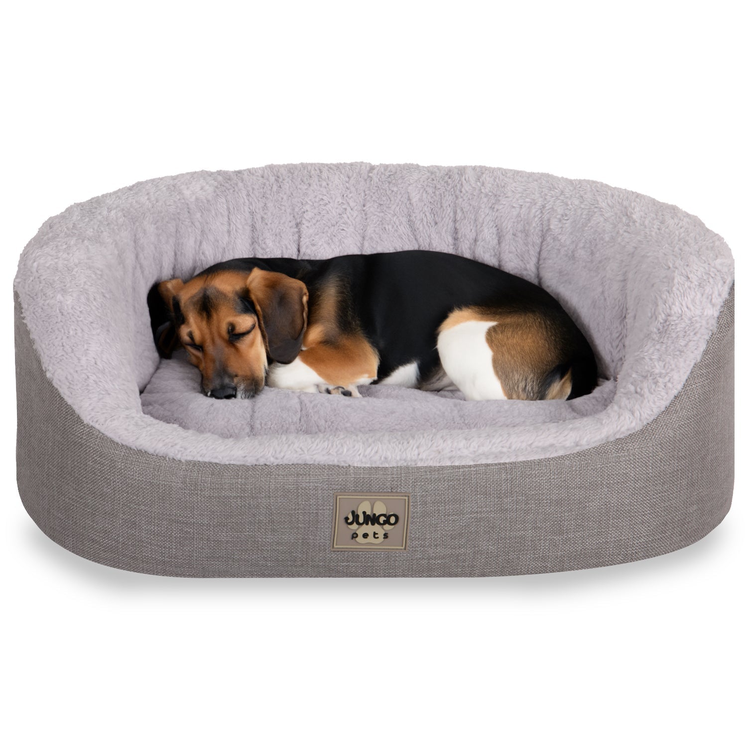 Dog sleeping on a soft, removable-cover pet bed with plush grey lining