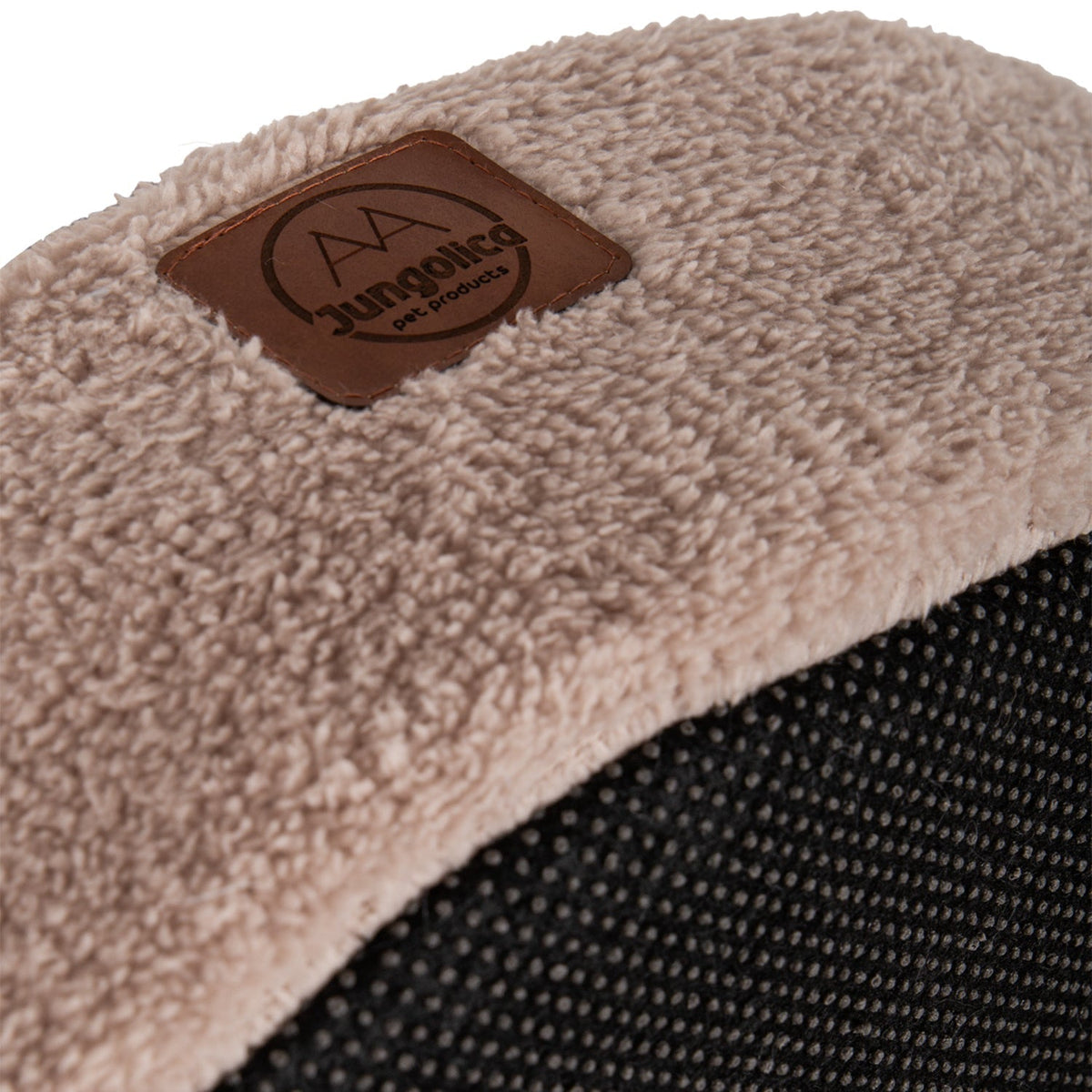Close-up of a beige ultra soft removable cushioned covered cat bed with textured fabric detail